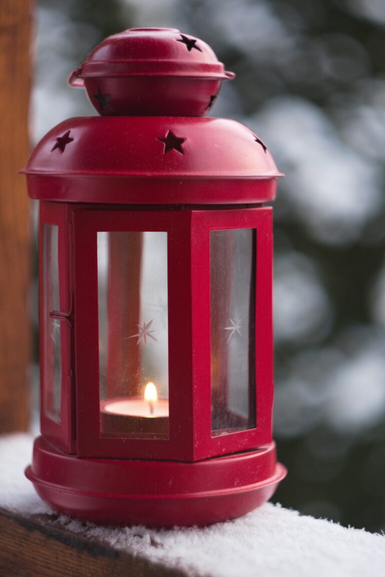 Red lantern in snow for winter gift traditions around the world